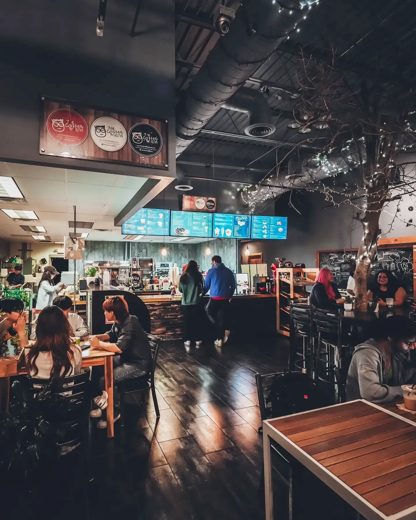 The floor busy under the lit menu boards.