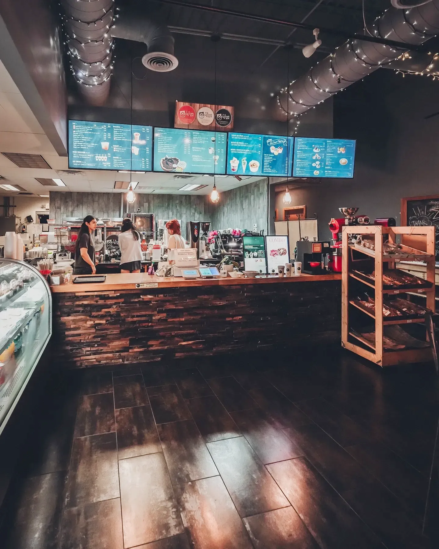 The counter under its lit menu boards.