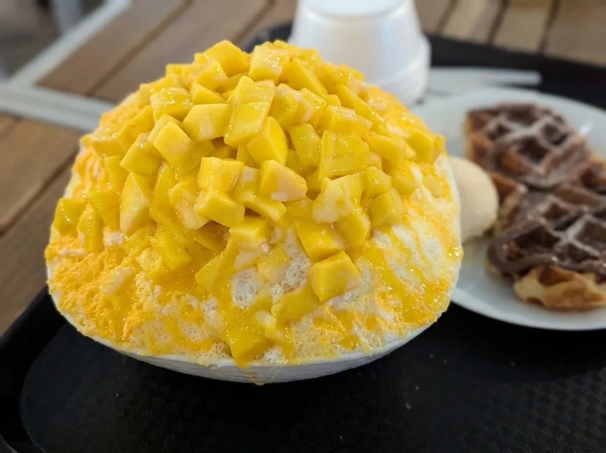 Mango bingsu with a waffle.