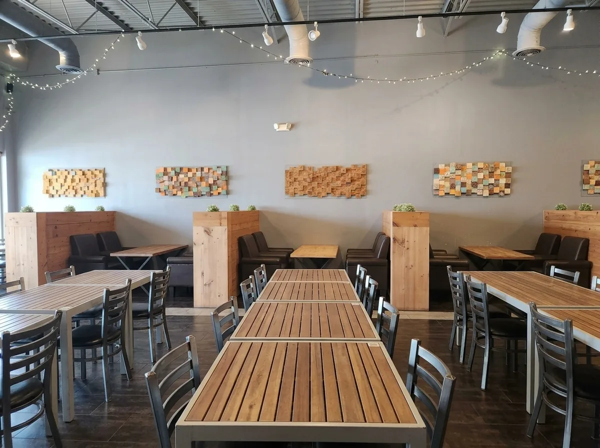 Long shared tables running down the middle of the room.